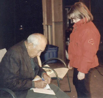  Harry Signs the Trappers Yearbook Article About His Life for a Young Admirer at a Talk Before the Tamworth Historical Society. 