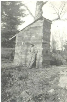  Harris about age 12 with early “trappering” shack. 