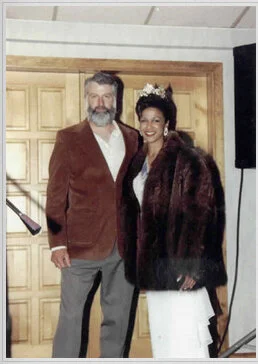 Miss NH 1996, Michelle Tolson, posing with her fur coat alongside NHTA President Roger Burnham.